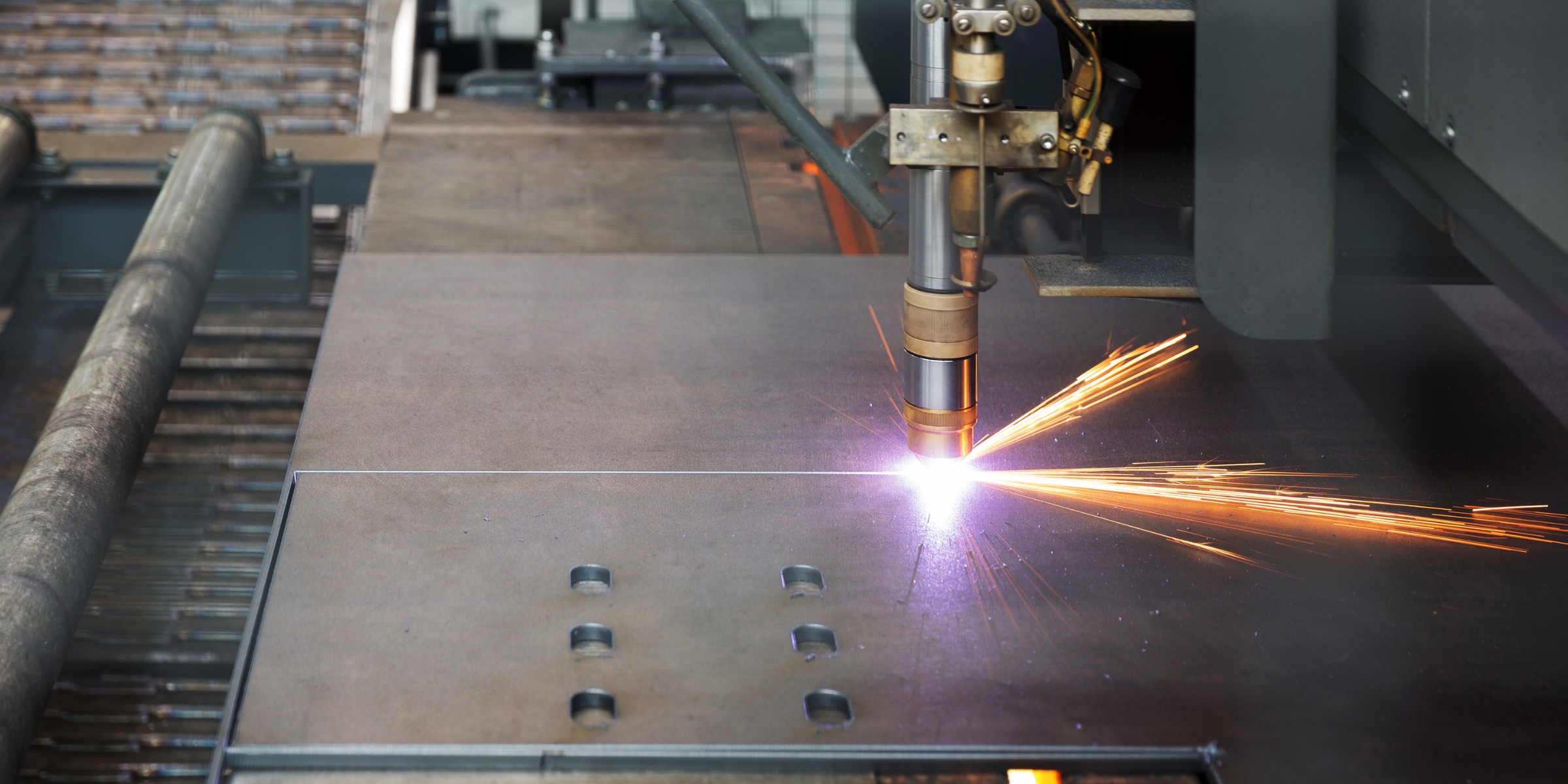 CNC plasma cutter cutting thick metal plate